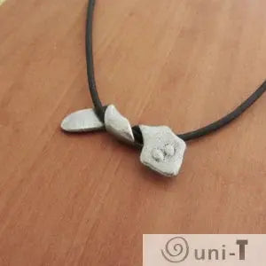 Planarian Pendant Jewelry necklace with silver flatworm-shaped pendant on black cord, ideal for science-themed fashion accessories.