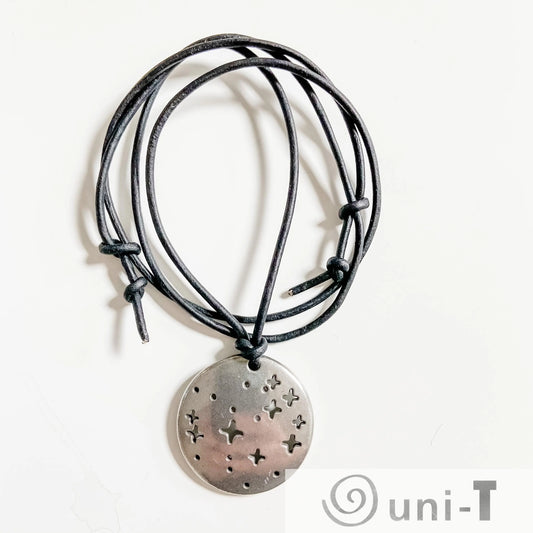 Pleiades Pendant - Pleiades Constellation Necklace with black cord and star cutouts. Ideal science jewelry for astronomy lovers and stargazers.