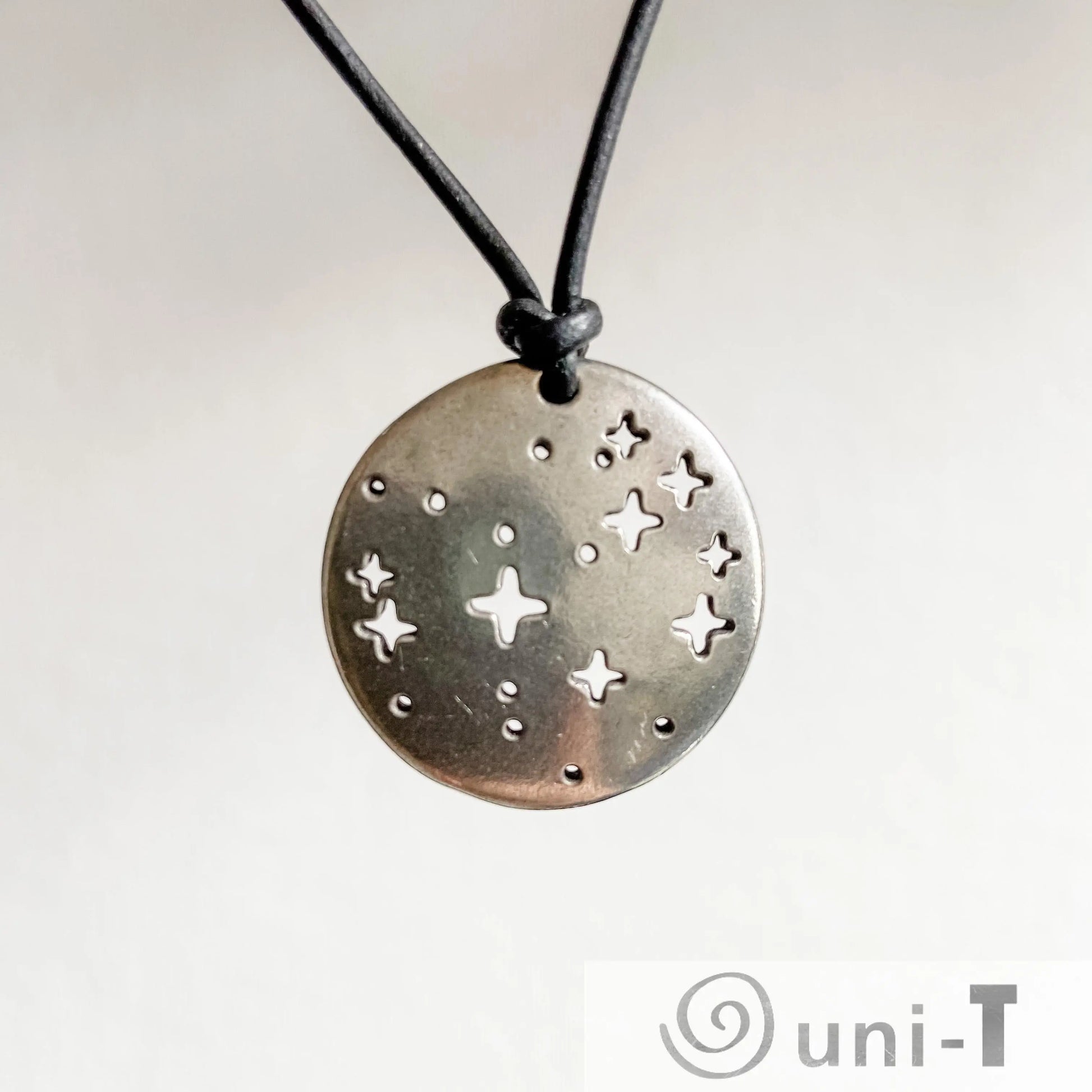 Detailed view of Pleiades Pendant - Pleiades Constellation Necklace with pewter star design. A unique science jewelry item for constellation fans.
