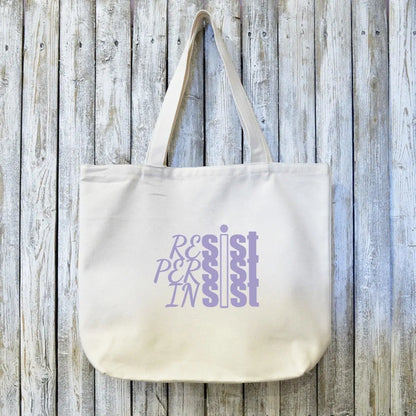 Activist gift canvas tote bag with RESIST PERSIST INSIST text in lavender ink on organic fabric. Eco-friendly and ideal for social justice events.