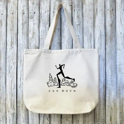 Runners Gift Tote Bag - RUN MORE Artist Design in black print on organic cotton canvas, ideal for eco-conscious fitness lovers and daily use.
