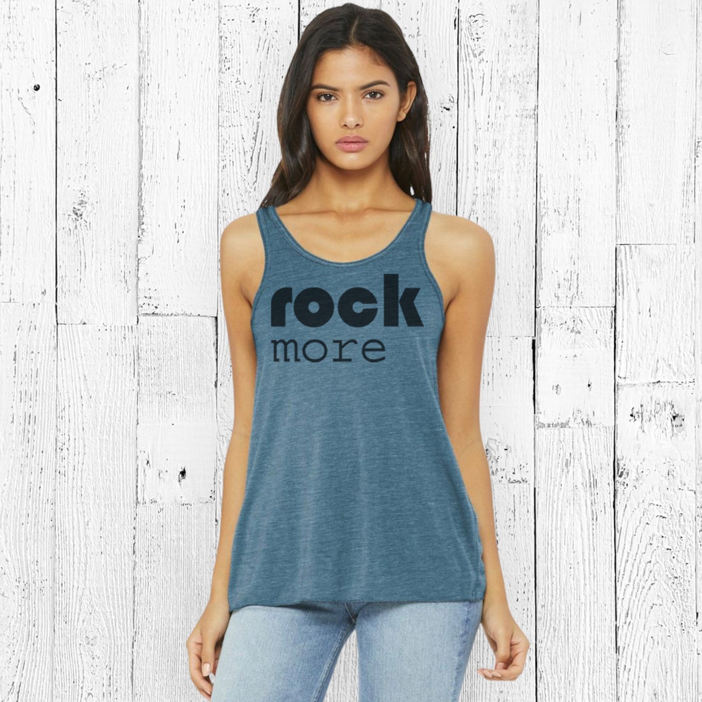 Model wearing teal Rock More Women's Flowy Tank Top with black print, showcasing racerback cut and soft eco-friendly fabric for casual style.