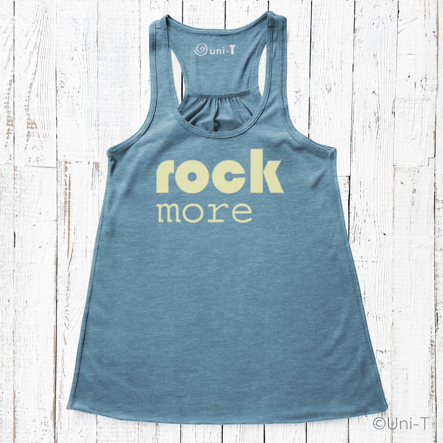 Teal Rock More Women's Flowy Tank Top with cream text, featuring a racerback and soft eco-conscious material, ideal for relaxed fashion.