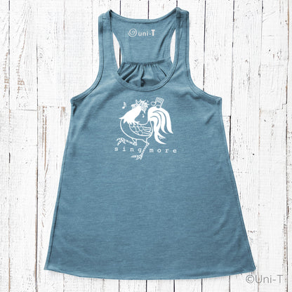 Blue Rooster Flowy Tank Top - Sing More featuring a white rooster design with music notes, perfect for confident singers and casual wear.
