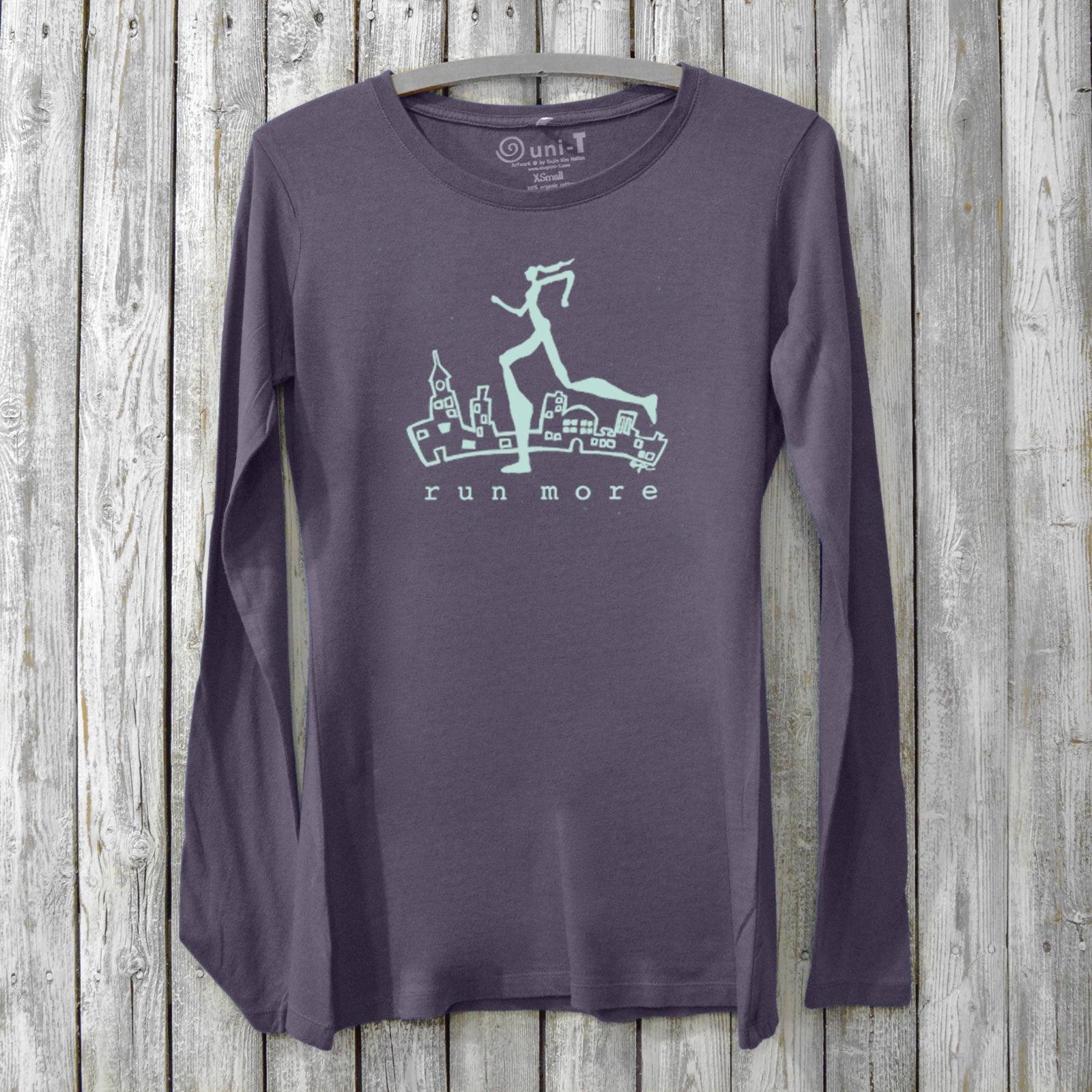 Run More Long Sleeve T-Shirt Women in dark purple with cityscape and runner graphic. Bamboo organic cotton activewear for running and fitness.