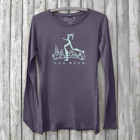 Run More Long Sleeve T-Shirt Women in dark purple with cityscape and runner graphic. Bamboo organic cotton activewear for running and fitness.