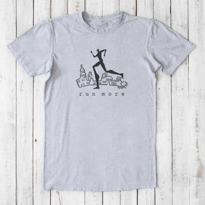 Heather gray 'Run More' men's graphic T-shirt in bamboo and organic cotton, featuring a black cityscape and runner silhouette.