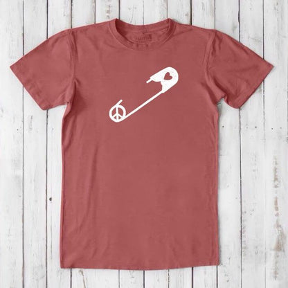 Red clay men's bamboo & organic cotton t-shirt with white safety pin and peace sign. Sustainable graphic tee for allyship and human rights.