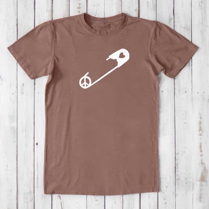 Light brown 'Safety Pin Ally' men's t-shirt made from bamboo & organic cotton. Features white peace and heart pin graphic for unity support.
