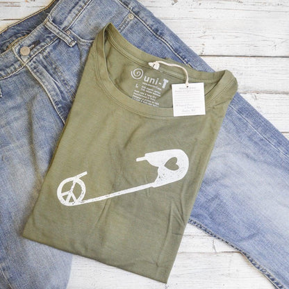 Olive green Women's Peace & Love T-Shirt folded with white safety pin and peace sign graphic. Sustainable bamboo and organic cotton fabric.