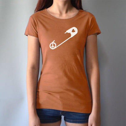 Rust-colored Women's Peace & Love T-Shirt with white safety pin design, worn by model. Ethical fashion statement for unity and kindness.