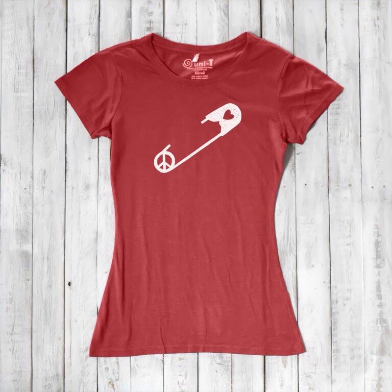Red Women's Peace & Love T-Shirt with white safety pin and peace symbol. Sustainable activist apparel for women promoting unity.
