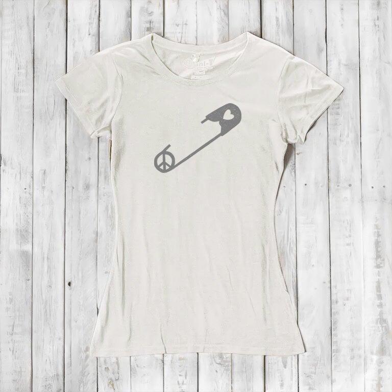 Ivory Women's Peace & Love T-Shirt with gray safety pin and peace sign graphic. Organic cotton blend tee for unity and love expression.