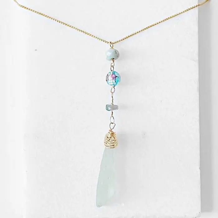 Front view of Sea Glass Necklace - Handmade Sea Glass Necklace with vertical pendant design, Murano bead, and tourmaline on a 16-inch gold chain.