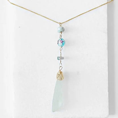 Front view of Sea Glass Necklace - Handmade Sea Glass Necklace with vertical pendant design, Murano bead, and tourmaline on a 16-inch gold chain.