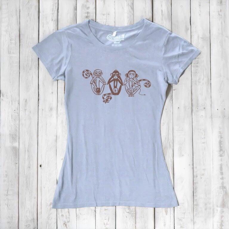 Light blue Women's Three Wise Monkeys T-Shirt made from bamboo & organic cotton, featuring a brown artistic monkey graphic for wisdom and mindfulness.