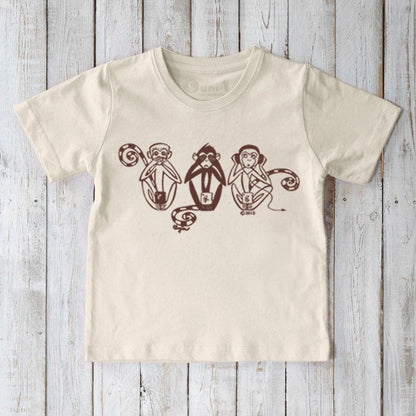 Kids' Three Wise Monkeys Organic Cotton T-Shirt in cream with playful 'See No Evil, Hear No Evil, Speak No Evil' monkey graphic. Eco-friendly fun top.