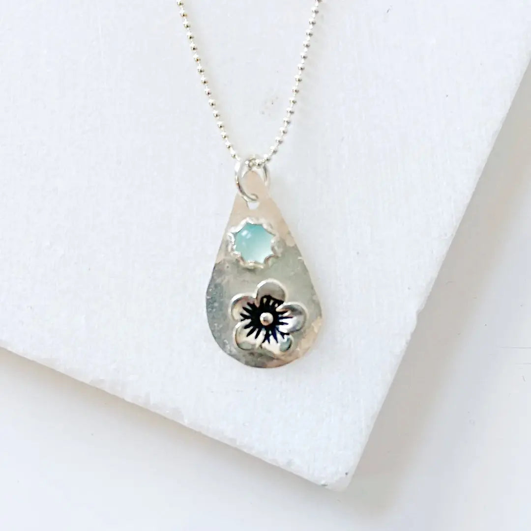 Sterling silver teardrop necklace with chalcedony stone and floral motif. A unique silver flower necklace perfect for gifting or daily wear.