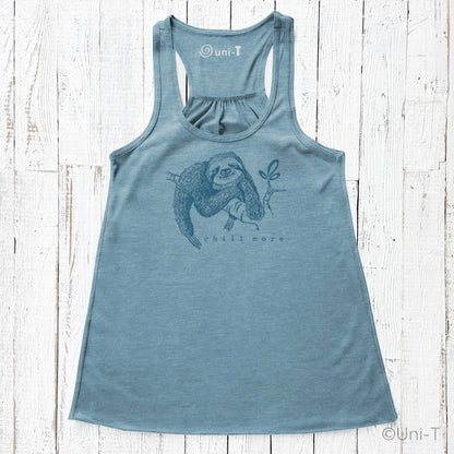 "Chill More" Women's Flowy Tank Top in dusty blue with sloth illustration, soft eco-conscious fabric ideal for yoga, lounging, or casual wear.