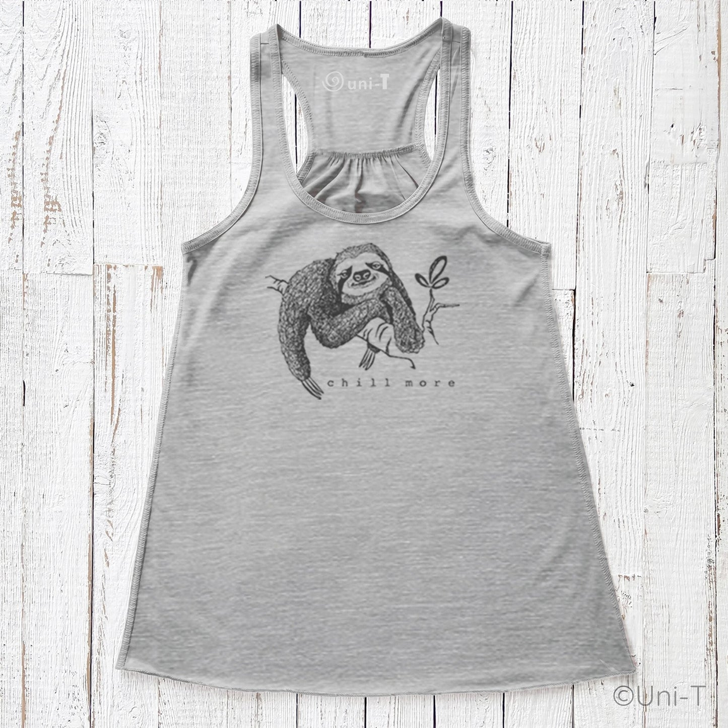 "Chill More" Women's Flowy Tank Top in light grey, racerback cut with mindful sloth design, perfect for relaxed, eco-friendly fashion lovers.