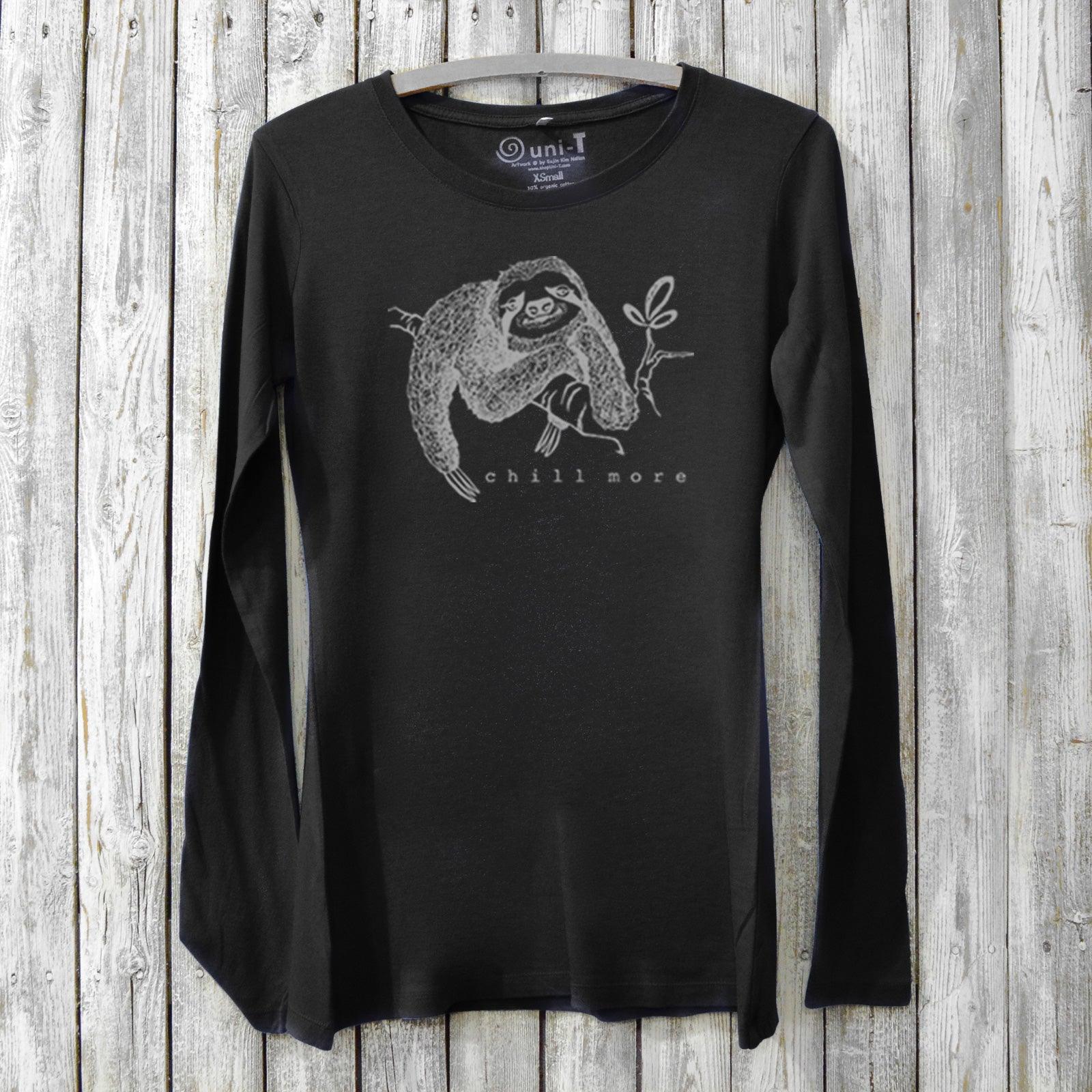 Black women's bamboo and organic cotton long sleeve tee featuring a sloth and 'Chill More' text. Soft, sustainable graphic shirt for relaxing days.