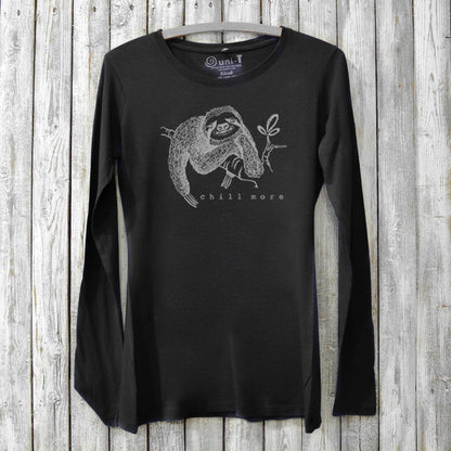 Black women's bamboo and organic cotton long sleeve tee featuring a sloth and 'Chill More' text. Soft, sustainable graphic shirt for relaxing days.