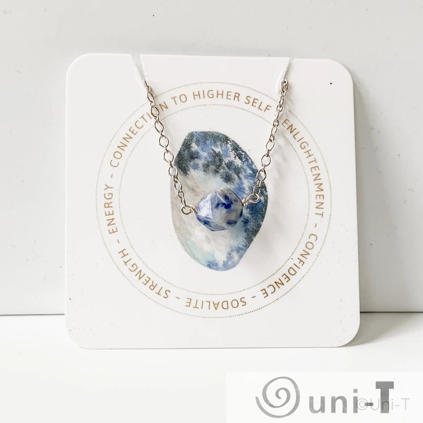 Uni-T Sodalite Gemstone Necklace displayed on branded card highlighting spiritual energy and confidence, ideal for mindful jewelry lovers.