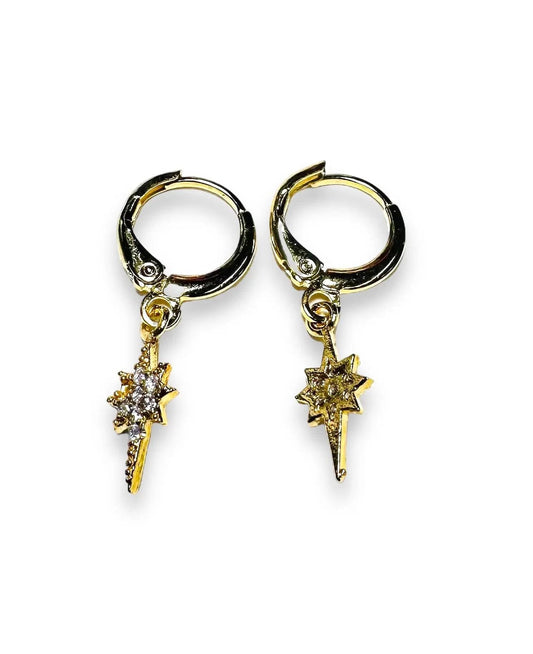 Star Huggie Hoops Earrings in gold with cubic zirconia star charms, featuring secure lever backs for celestial-inspired jewelry style.