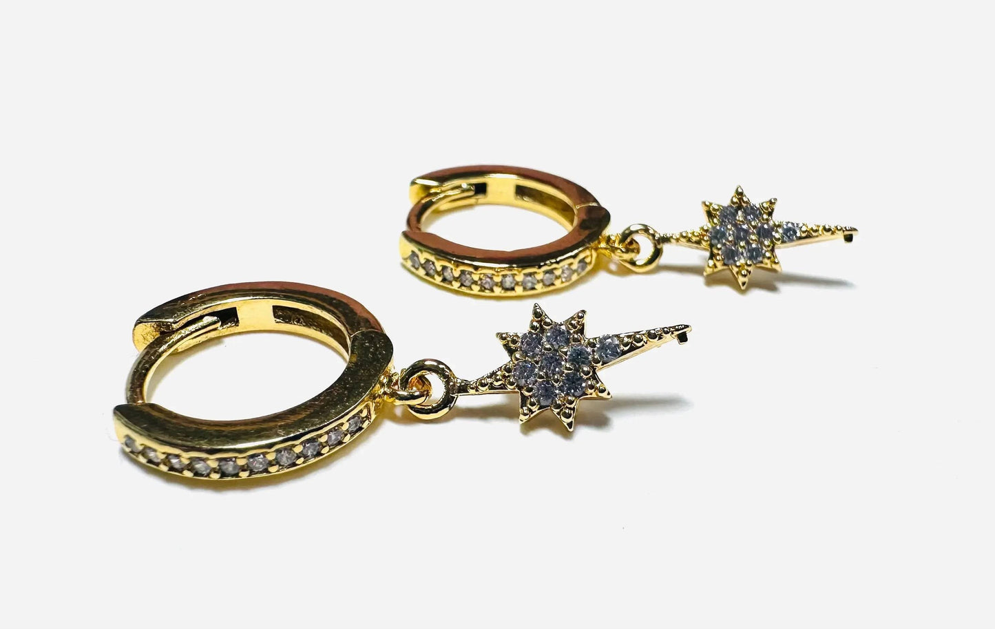 Star Huggie Hoops Earrings with gold finish and cubic zirconia accents, blending celestial charm with modern jewelry elegance.