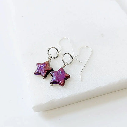 Sterling silver earrings with deep purple freshwater star pearls. Eye-catching and artistic design for special occasions.