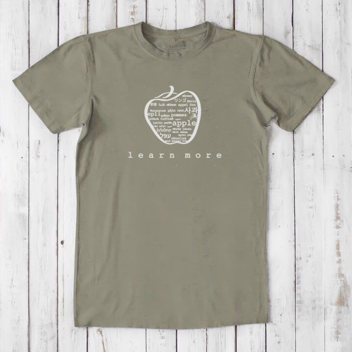 Olive green Men's Teacher T-Shirt in Bamboo & Organic Cotton featuring white apple graphic and 'learn more' message for educators.