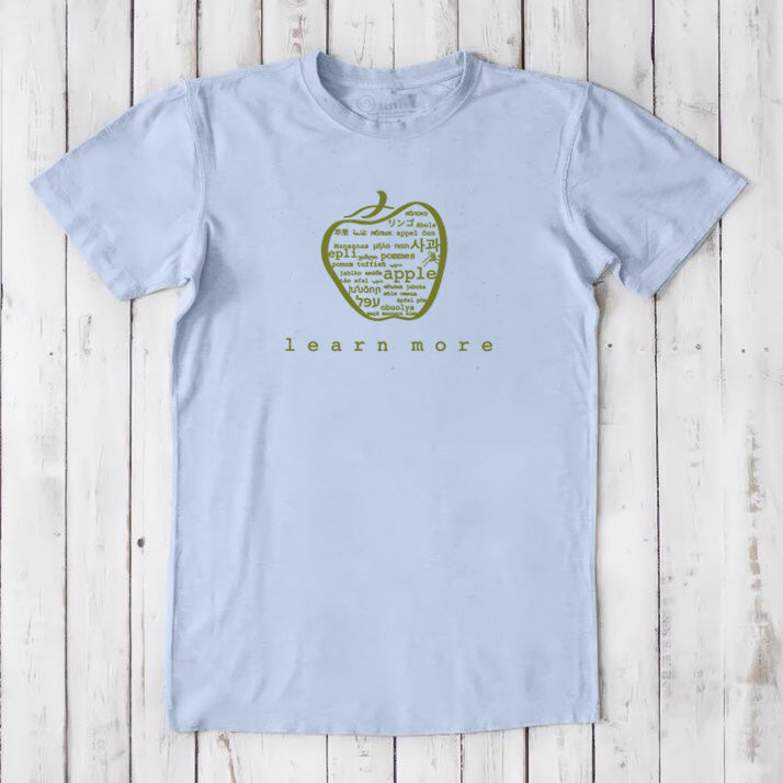 Light blue Men's Teacher T-Shirt in Bamboo & Organic Cotton with green apple graphic and 'learn more' text, perfect educator gift.