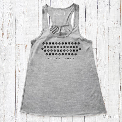 Heather gray "Write More" flowy tank top featuring eco-friendly ink and a retro typewriter layout. Lightweight and perfect for literary lovers.