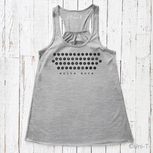 Heather gray "Write More" flowy tank top featuring eco-friendly ink and a retro typewriter layout. Lightweight and perfect for literary lovers.