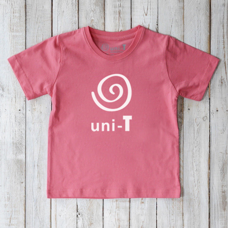 Pink Kids' Unity T-Shirt made from eco-friendly organic cotton with white Uni-T spiral logo. Soft and sustainable graphic tee.