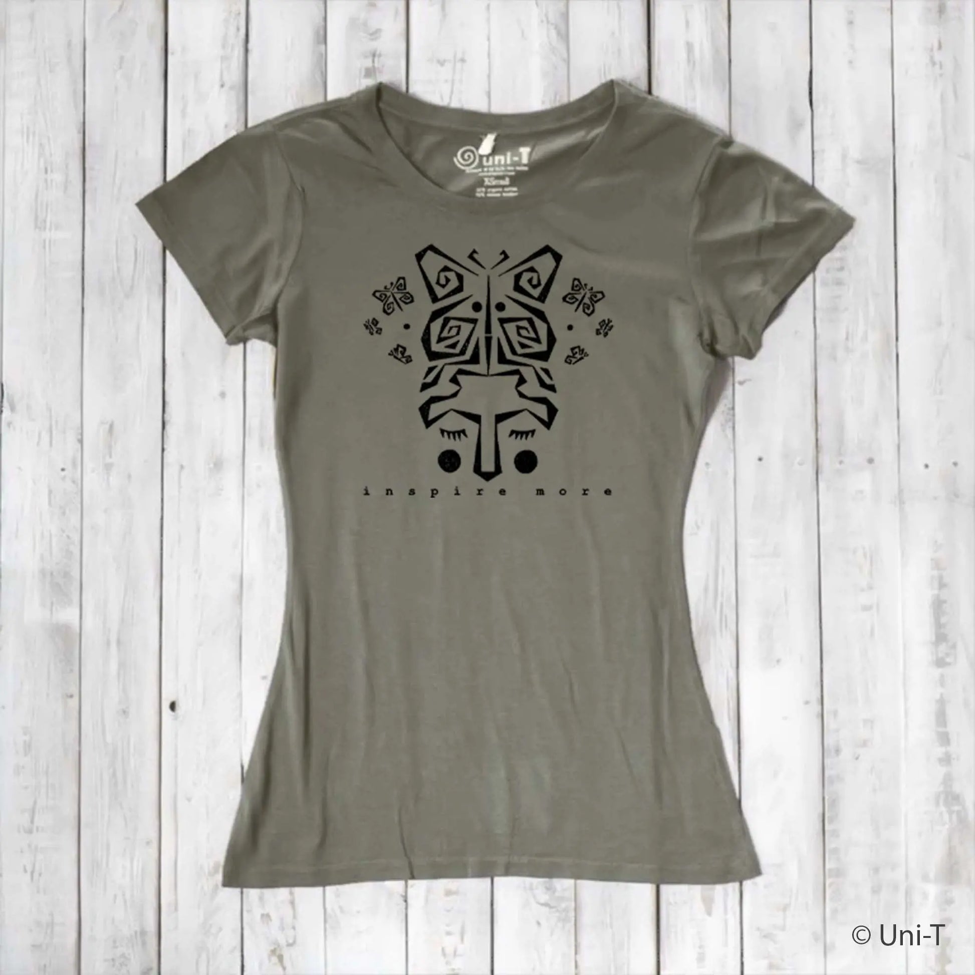 Olive green women's bamboo and organic cotton t-shirt with black butterfly face graphic and 'Inspire More' message. Sustainable nature-inspired tee.