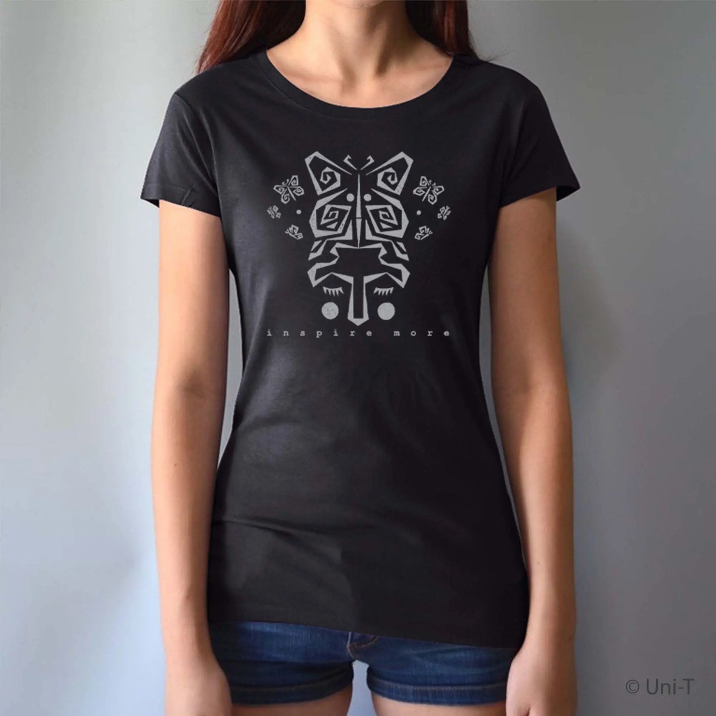 Black women's bamboo and organic cotton t-shirt with gray butterfly face design and 'Inspire More' message. Inspirational eco-friendly graphic tee.