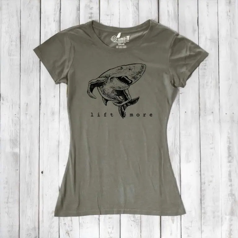Olive green women's shark T-shirt in bamboo and organic cotton with 'Lift More' graphic. Eco-friendly gym tee for fitness motivation.