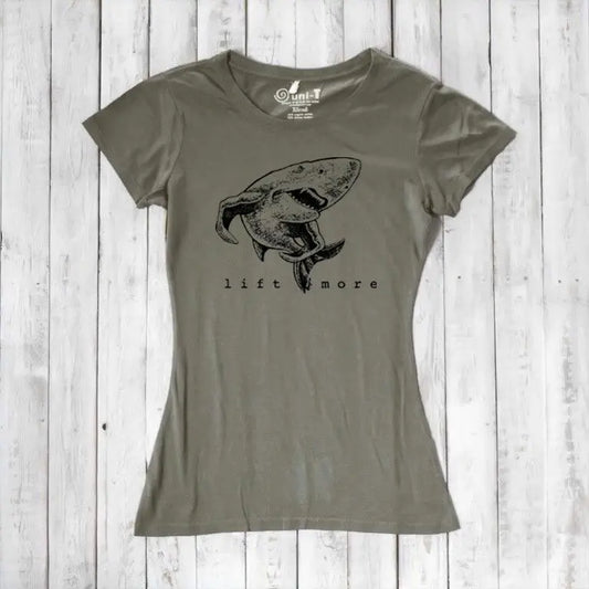 Olive green women's shark T-shirt in bamboo and organic cotton with 'Lift More' graphic. Eco-friendly gym tee for fitness motivation.