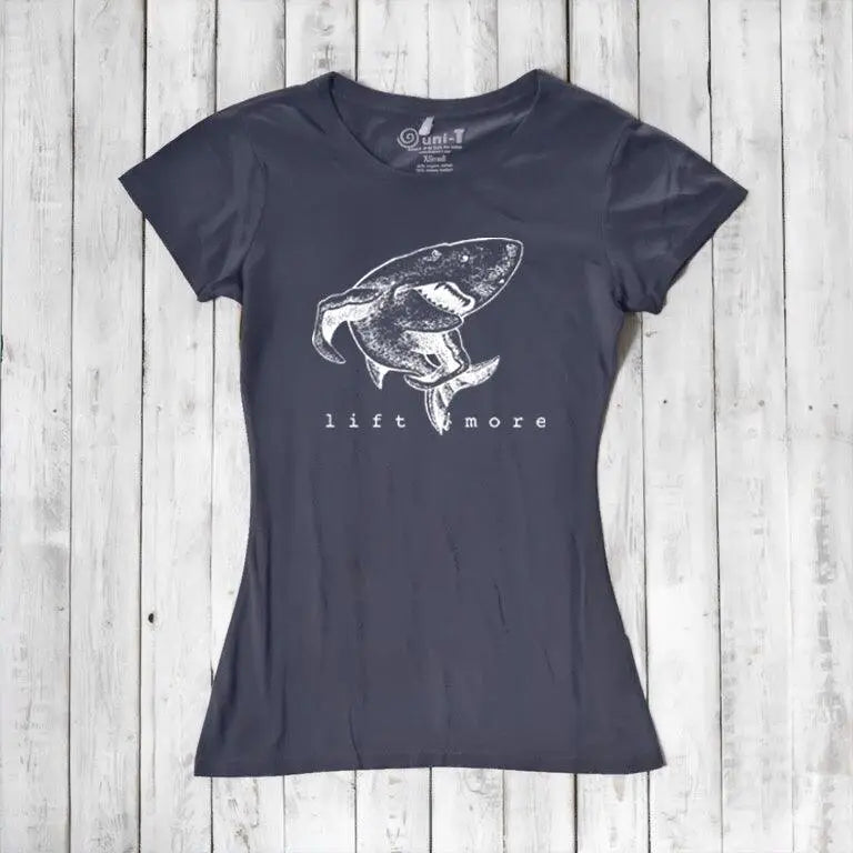 Charcoal gray women's bamboo and organic cotton T-shirt with shark 'Lift More' design. Motivational fitness top for weightlifters.
