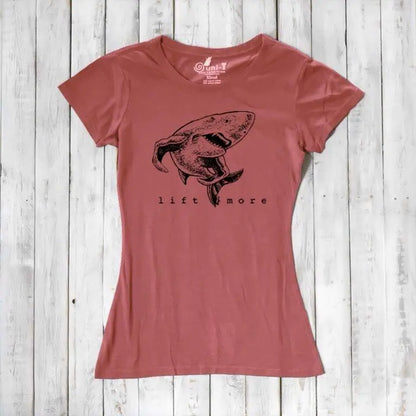 Rust red women's shark T-shirt with 'Lift More' print, crafted from bamboo and organic cotton. Sustainable gym motivation top.