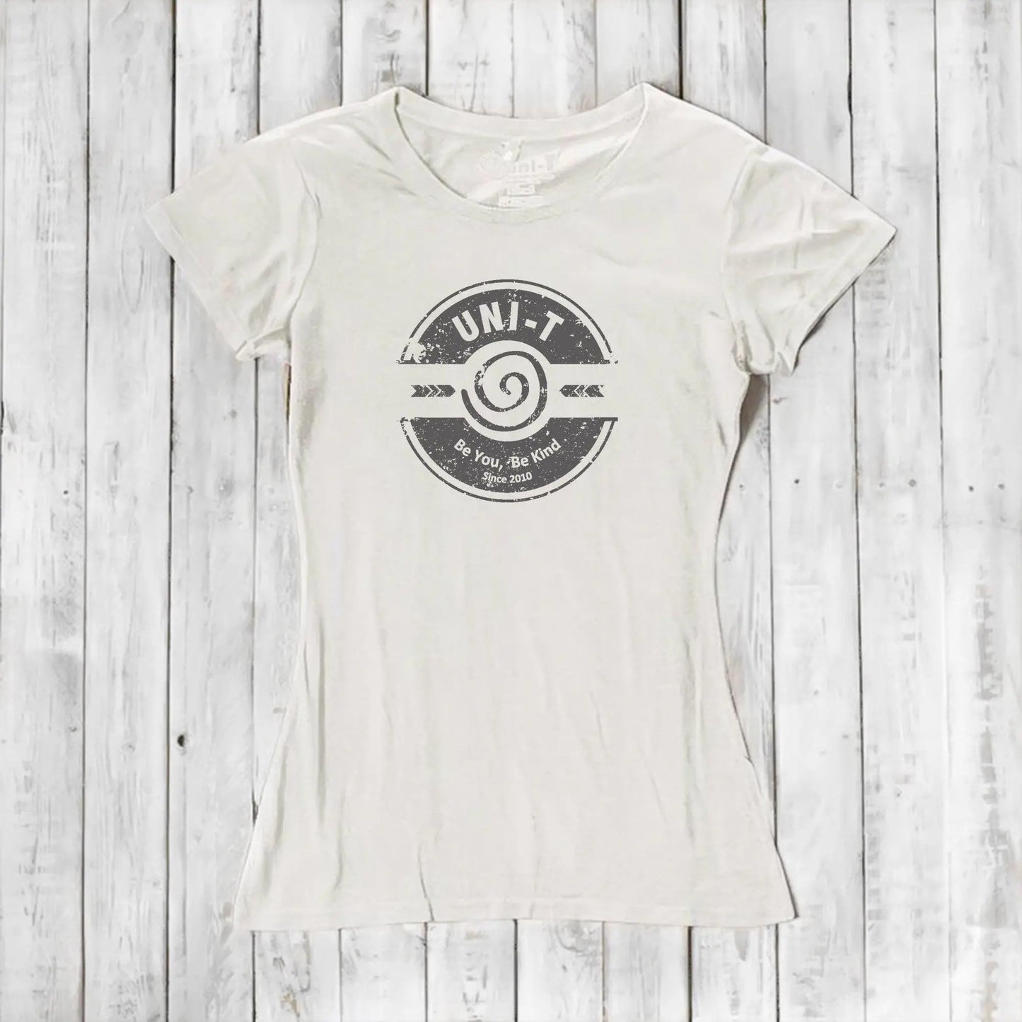 Cream-colored inspirational women's T-shirt made from bamboo and organic cotton featuring Uni-T's 'Be You Be Kind' positive vibe graphic.