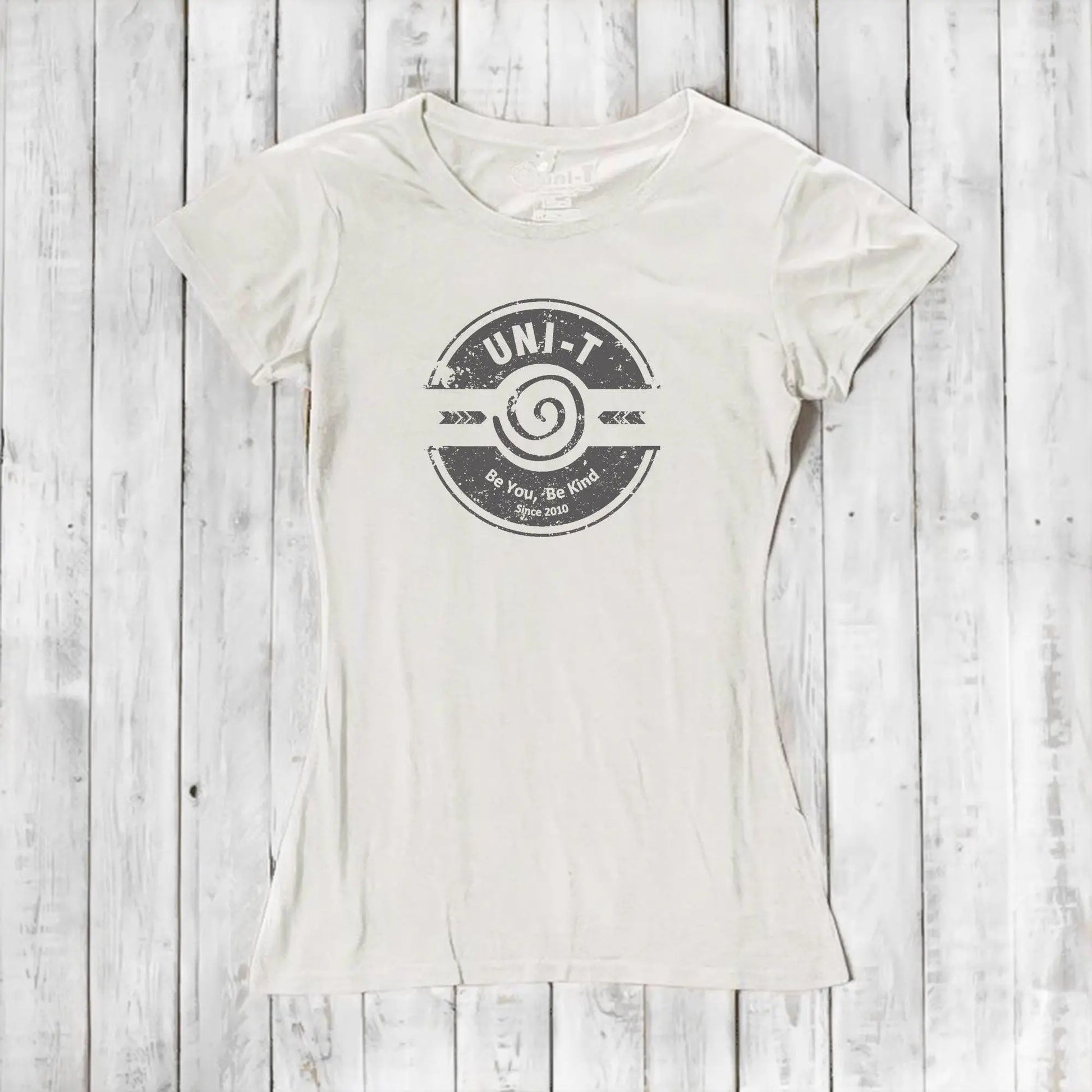 Cream-colored inspirational women's T-shirt made from bamboo and organic cotton featuring Uni-T's 'Be You Be Kind' positive vibe graphic.