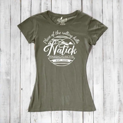 Olive green women's Natick T-Shirt made from bamboo and organic cotton, featuring 'Place of the Rolling Hills' hometown pride graphic. Sustainable Massachusetts apparel.