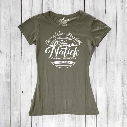 Olive green women's Natick T-Shirt made from bamboo and organic cotton, featuring 'Place of the Rolling Hills' hometown pride graphic. Sustainable Massachusetts apparel.