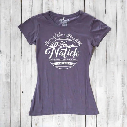 Purple women's Natick T-Shirt in bamboo and organic cotton blend with 'Place of the Rolling Hills' Massachusetts graphic. Eco-friendly local pride clothing.