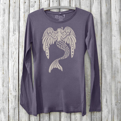 Purple organic cotton women's long sleeve shirt with mermaid holding justice scales graphic, 'The Magnificent' design by Uni-T. Sustainable and artistic.