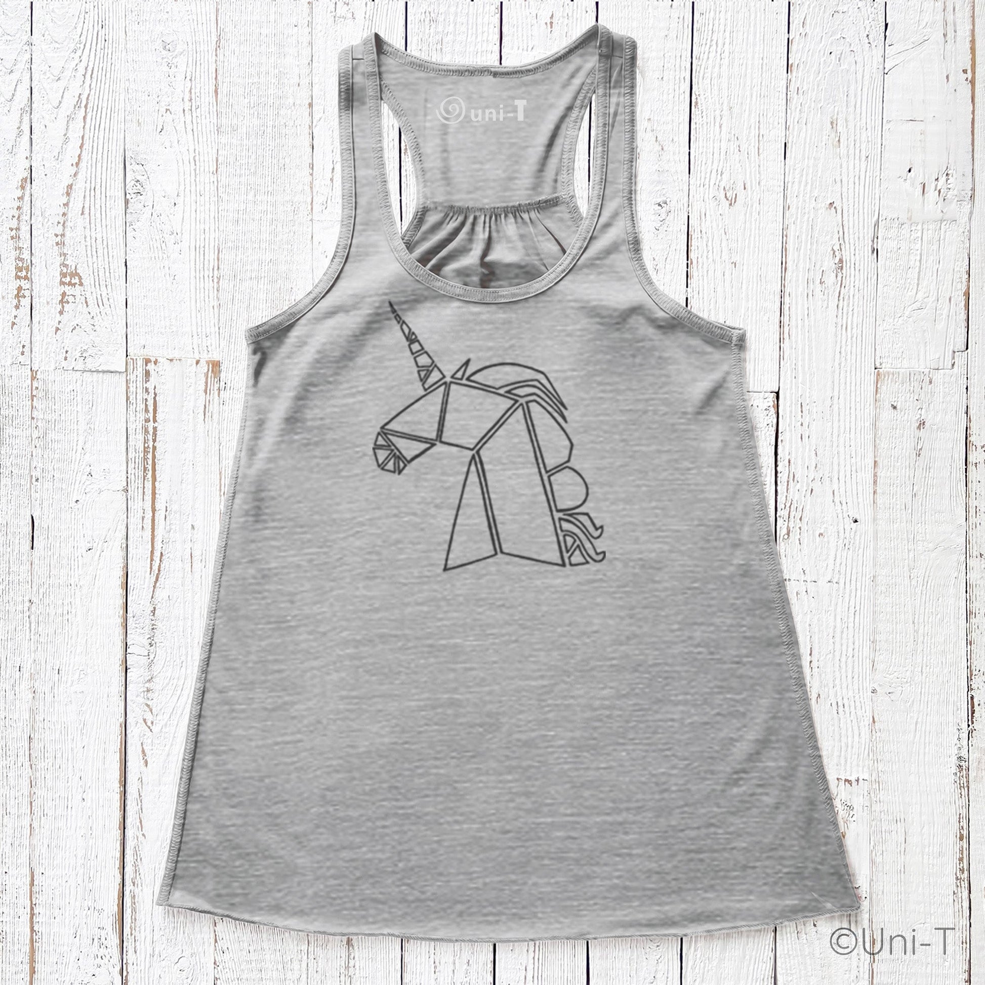 Heather gray unicorn flowy tank top for women with a bold unicorn graphic. Racerback style offers breathable comfort and whimsical flair.