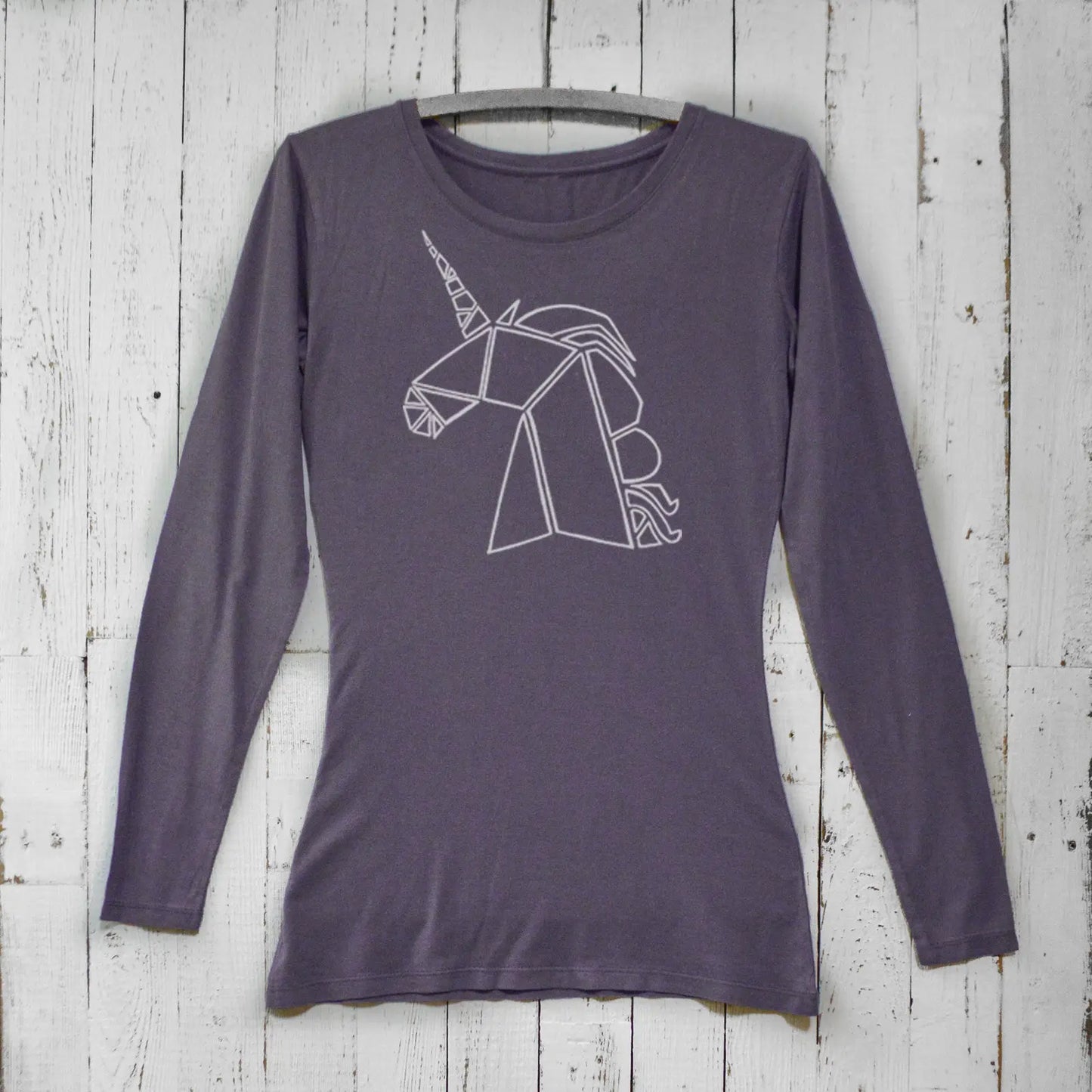 Dark purple unicorn long sleeve t-shirt for women in bamboo organic cotton. Stylish fantasy apparel with geometric unicorn graphic.