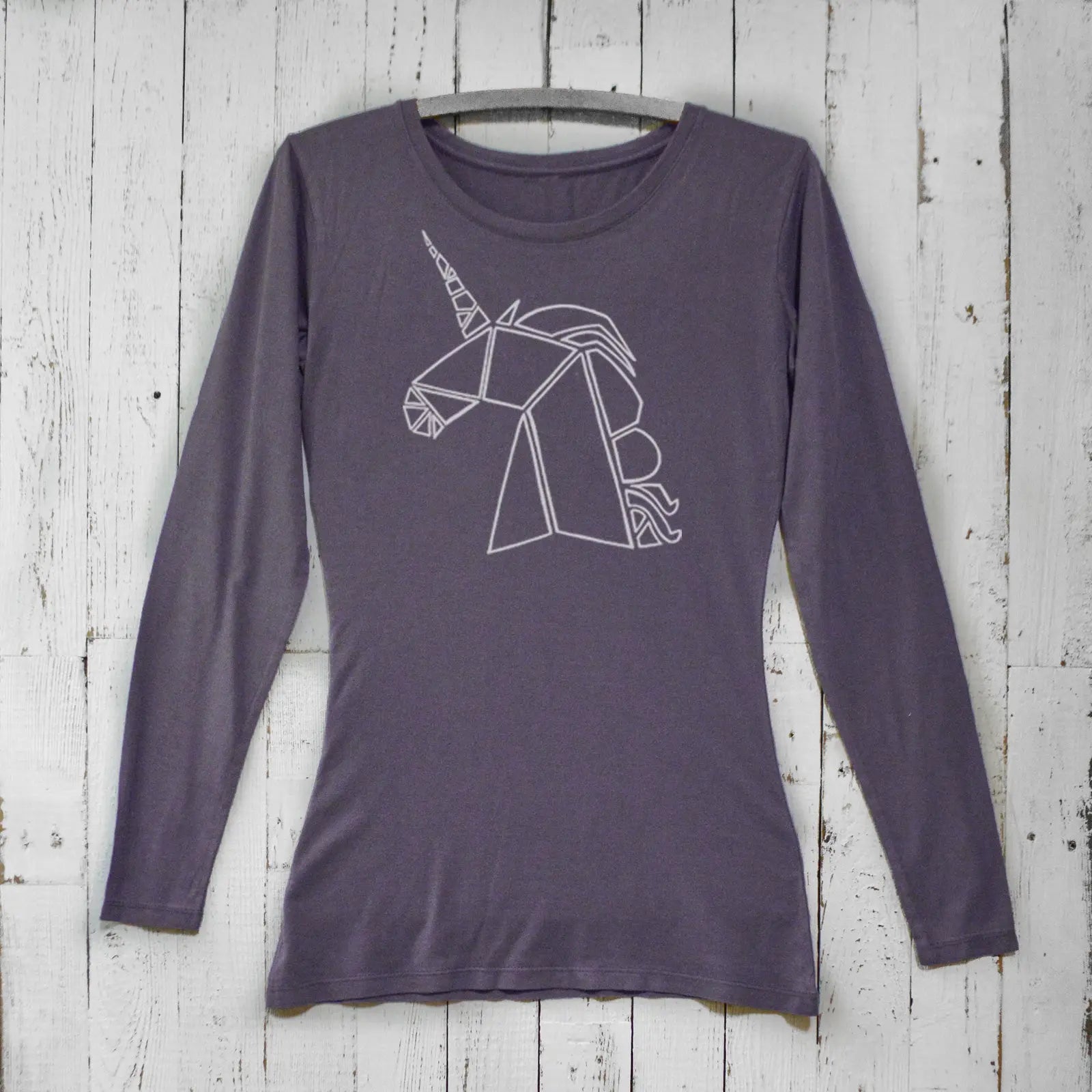 Dark purple unicorn long sleeve t-shirt for women in bamboo organic cotton. Stylish fantasy apparel with geometric unicorn graphic.